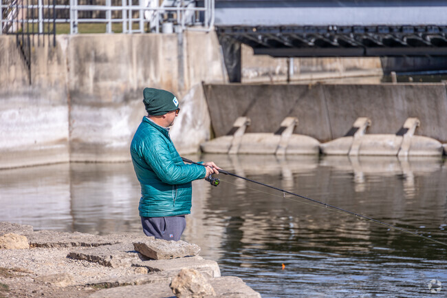 Residents fish off the docks at Cornish Park along the Fox River.