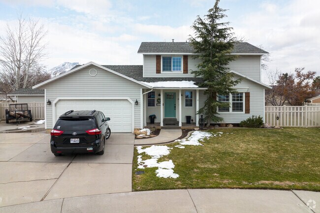 A two-story residence in Cascade neighborhood combines comfort with a two-car garage.