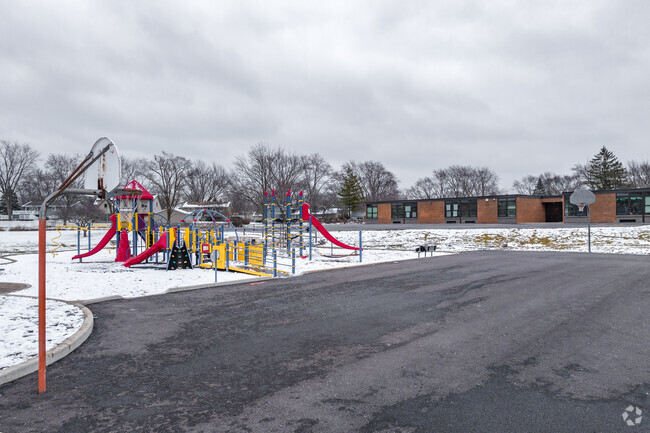 Thomas Dooley Elementary School features a large playground and full-court basketball courts.