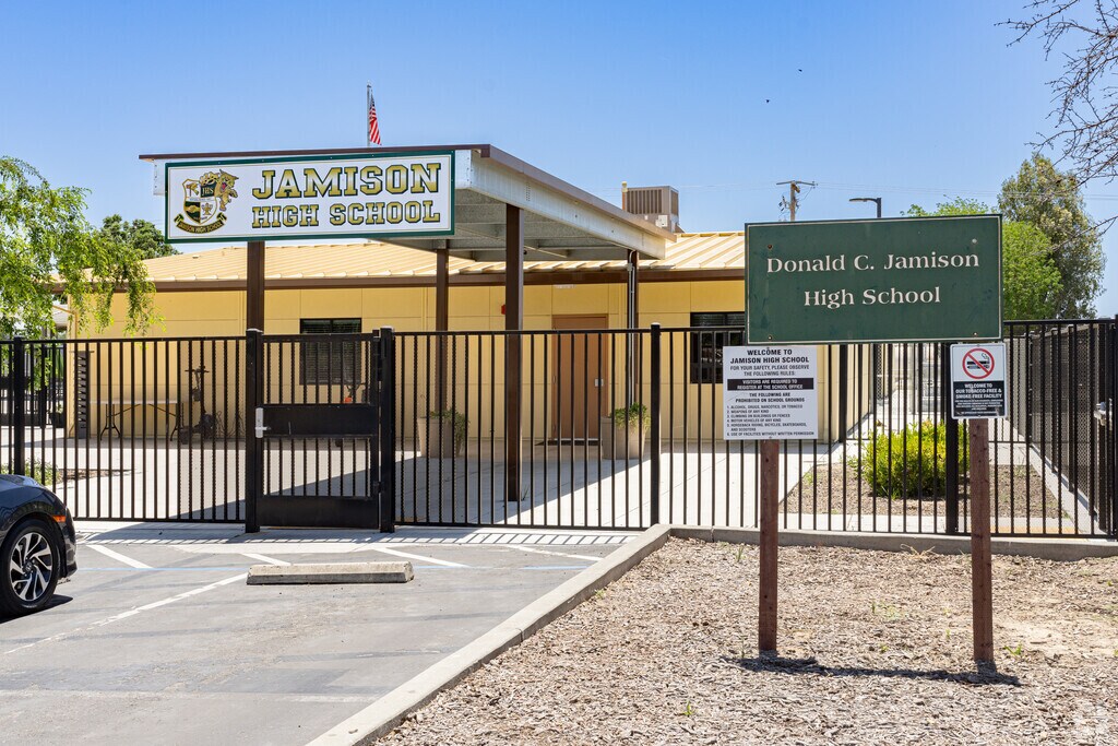 A sign outside the entrance to Donald C. Jamison High School welcomes students to the campus.