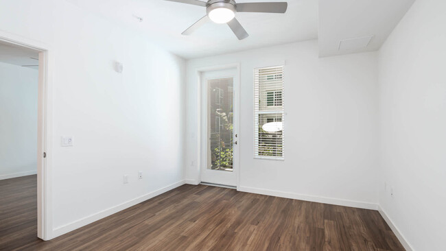 Bedroom with Balcony and Hard Surface Flooring
