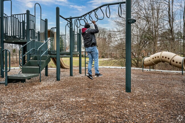 You can use the playground at Rolling Roads Park to exercise.