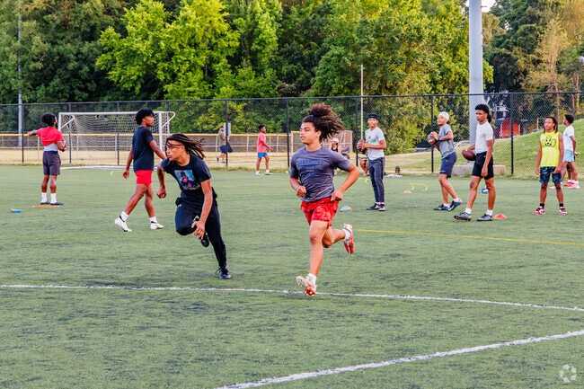 Teens from Hilltop utilize the fields at the Smith Soccer Complex for football practice.