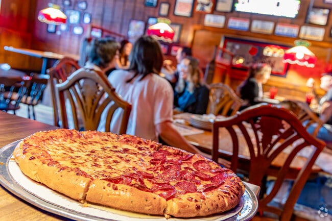 For a late-night slice, residents head over to Hounddog’s, known for its massive, foldable pies.