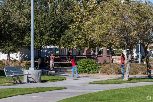 Angeles Acres kids flock to the playground at Hesperia Civic Plaza Park after school.