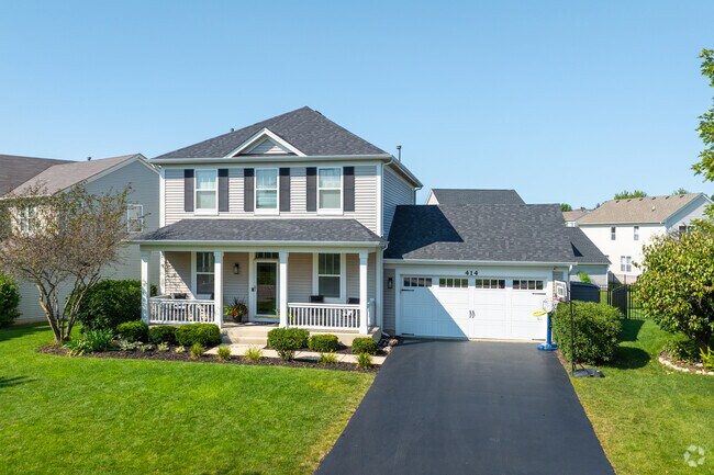 This home in Harvest Hills has a covered front porch and garage.