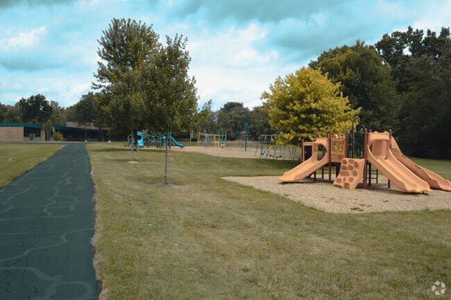 Colorful play structures are lined along the walking paths at the Dicken Elementary School.