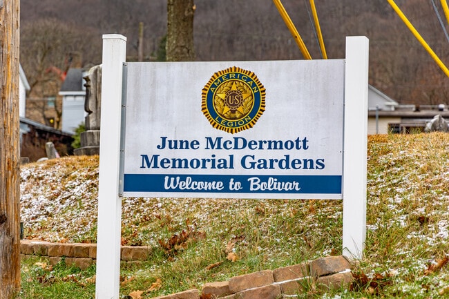 June McDermott Memorial Gardens has a sign that welcomes drivers entering the town of Bolivar.