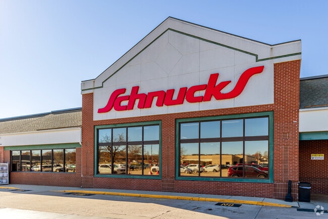 Residents do their grocery shopping at Schnucks in Columbia.