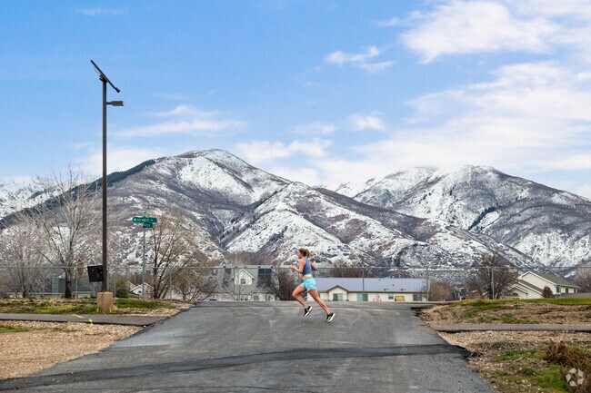 A woman jogs on Wetlands Discovery Point Trail in West Kaysville.