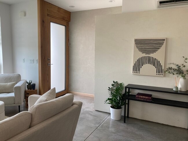 Front door and entry into living room