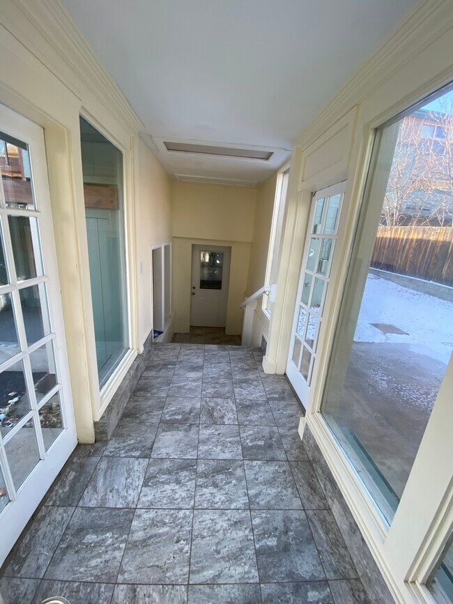 Covered vestibule/mudroom from garage to front door