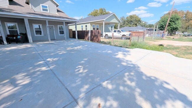 Long paved drive for parking of up to four vehicles.