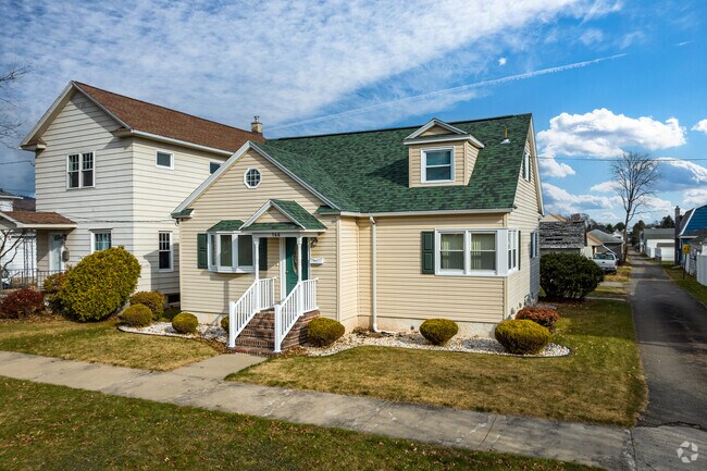 A modern cottage style home on a small residential lot located in Wyoming, PA.