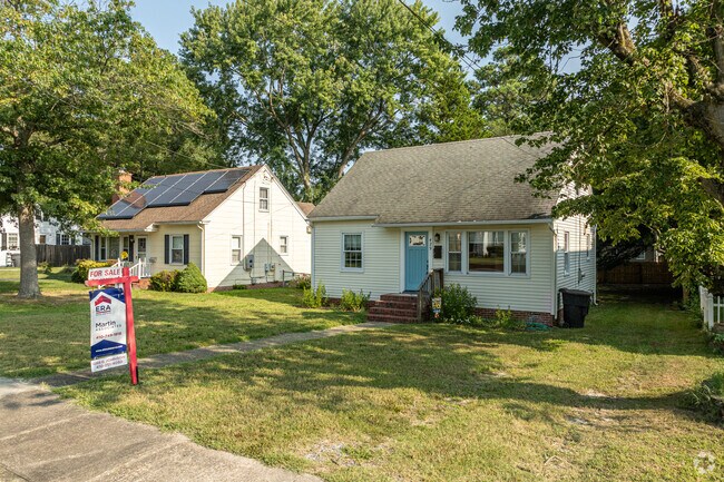 Two Cape Cods sit close to one another on small lots in North Camden.