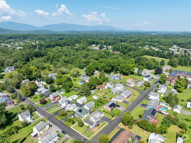 Gloss is surrounded by lush woodlands and rolling hills.