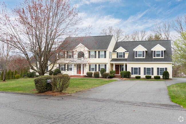 A stately colonial situated in a quiet part of Dracut.
