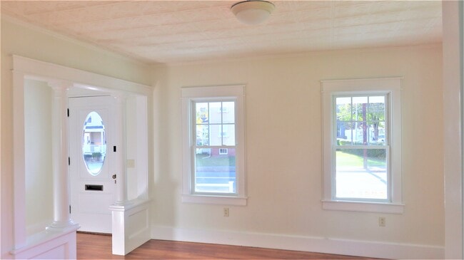 Front parlor is crowned with the original tin ceiling