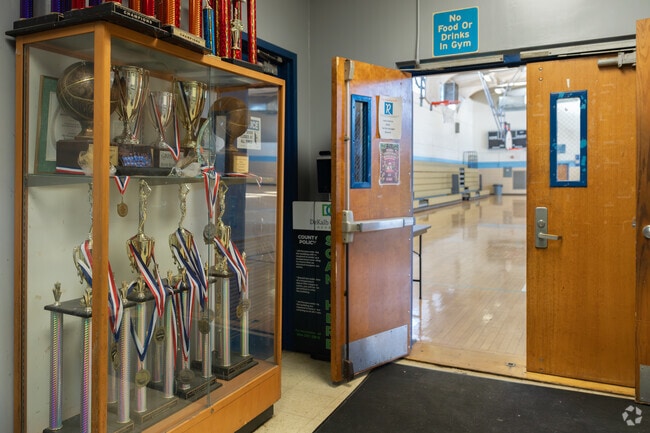 The center features a full-size gymnasium, multipurpose rooms, a kitchen, a meeting room, and a playground.