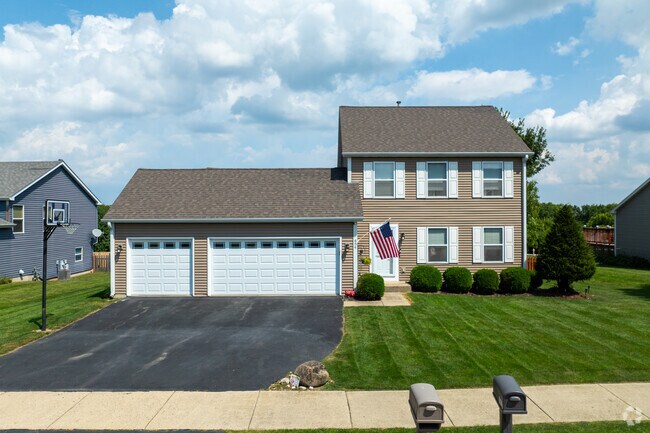 Colonial-inspired homes offer spacious front lawns.