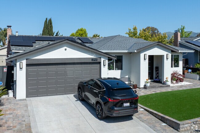 This modernized California Ranch in Cataldi features clean lines, solar panels, and drought-smart design.