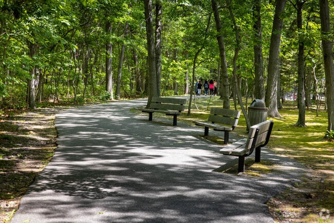 Take a stroll along the paved paths of Robert J. Henke Nature Preserve in Lake Grove.