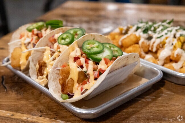 Natick residents recommend the fish tacos at Apponaug Brewery as a must-try dish.