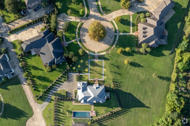 The Lakes District boasts big backyards with pools and big garages.