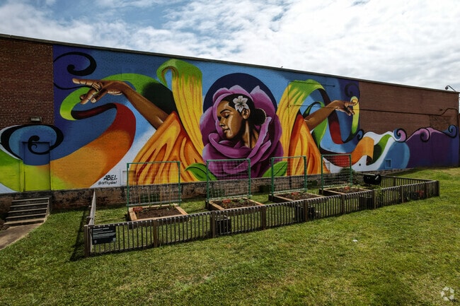 A beautiful mural is the backdrop to the local garden in Double Oaks.