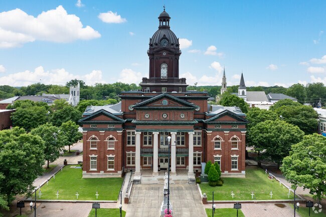 The Coweta County Courthouse, designed by J.W. Golucke, was built in 1904 in the Neoclassical Revival style.