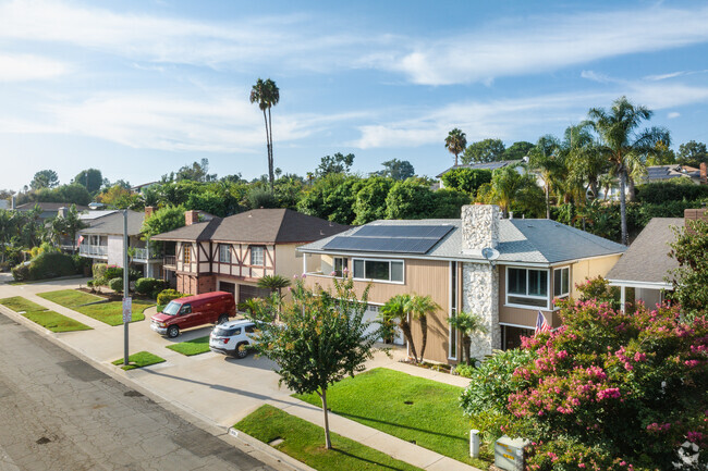 Two-story homes line the streets of a residential area in Lower Raymond Hills.