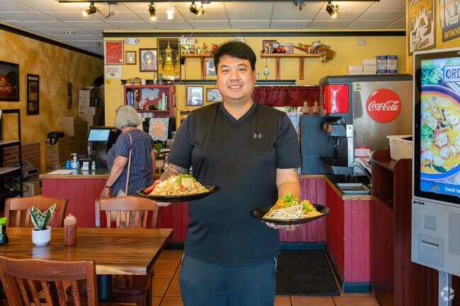 The proud owner of Thai Boat takes time to help serve Orcutt residents.