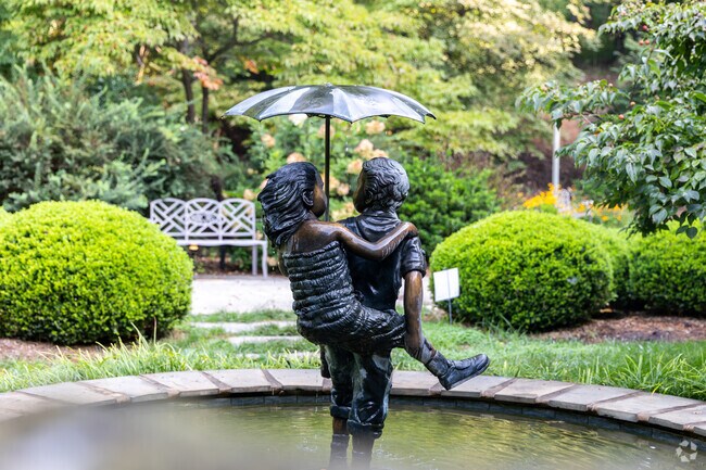 A statue showing friendship located along a walking trail in the Lakeside area.