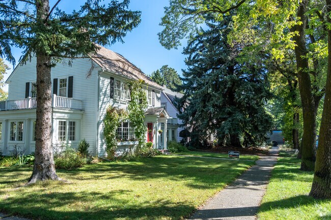 The University neighborhood has several larger two-story homes on tree-lined streets.