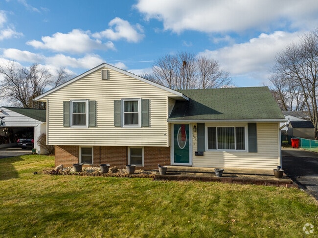 This charming split level home is nestled in the Far South Community.