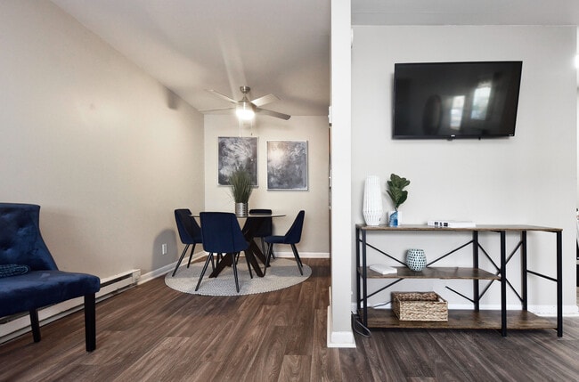 Explore a chic and inviting dining and living area, featuring contemporary decor and seamless design.