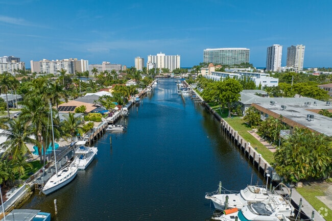 Various home types line this canal in the Harbor Village neighborhood of Pompano Beach, FL.
