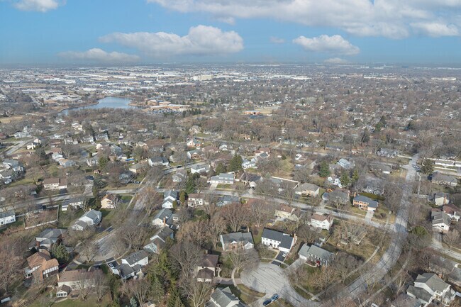 Large traditional and Colonial-inspired homes sit on quiet streets in the Watts neighborhood.