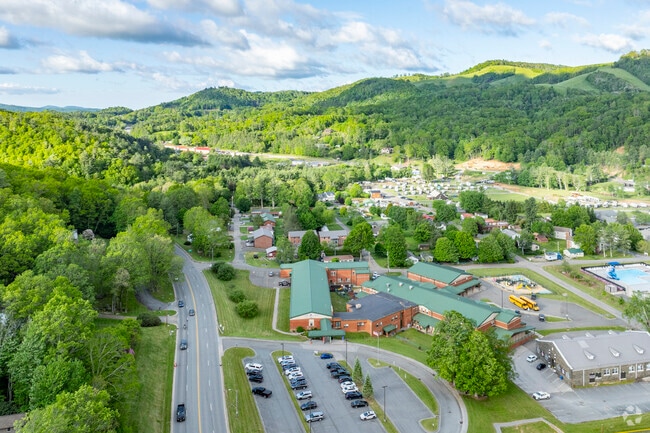 Located in the scenic town of Newland, the school provides a serene setting conducive to learning and growth.