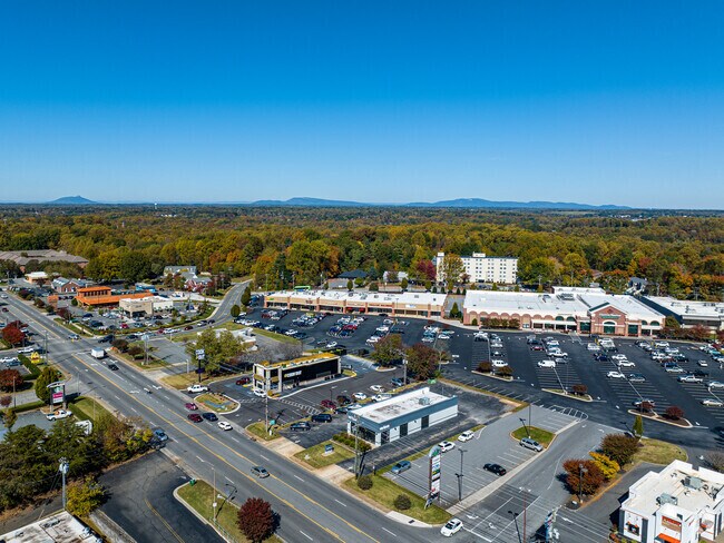Town and Country Estates has nearby shopping plazas with Pilot Mountain in the distance.