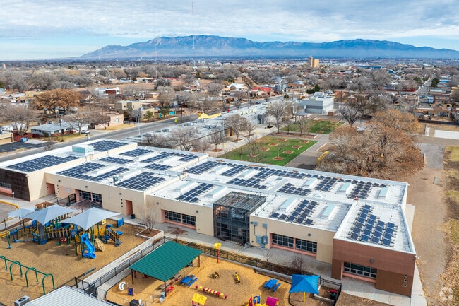 Reginald Chavez Elementary with it's rooftop solar array and the Sandia Mountains.