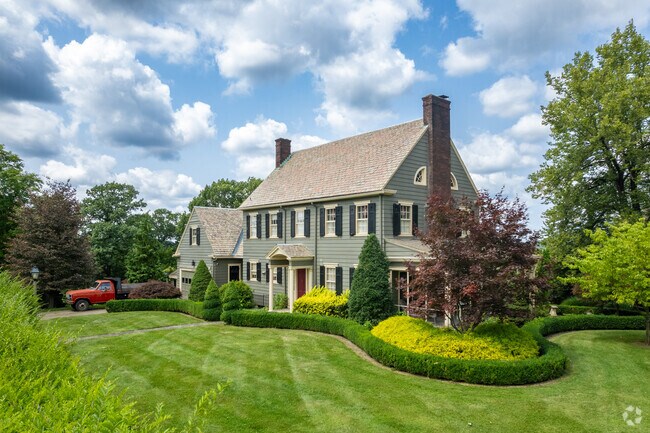 This large Colonial style home with immaculate landscaping tops a hill in Moon Township.