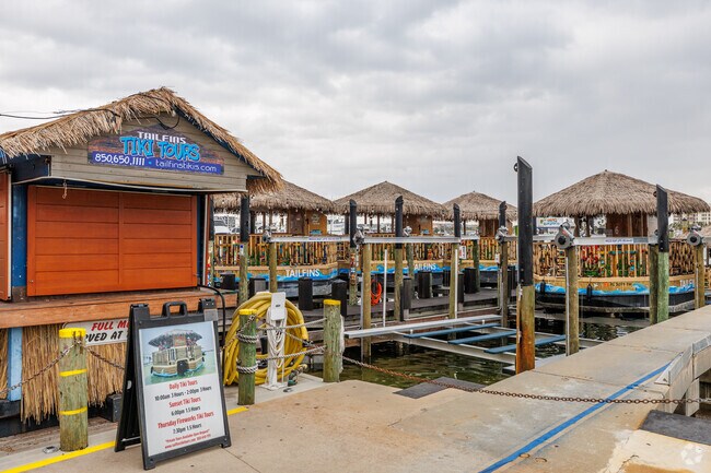 Tailfins Destin tiki boat tours and Crab Island tours let you experience the beauty of Destin Harbor, where you can see dolphins.