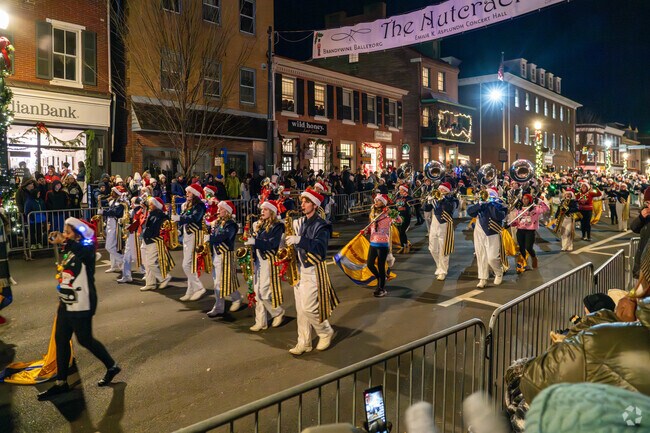 A high school marching band leads off the West Chester Christmas Parade.