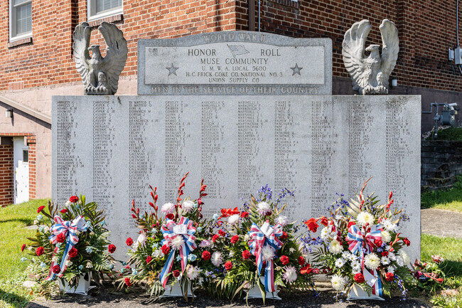 Residents pay respect to World War II Vets at the memorial in central Muse.