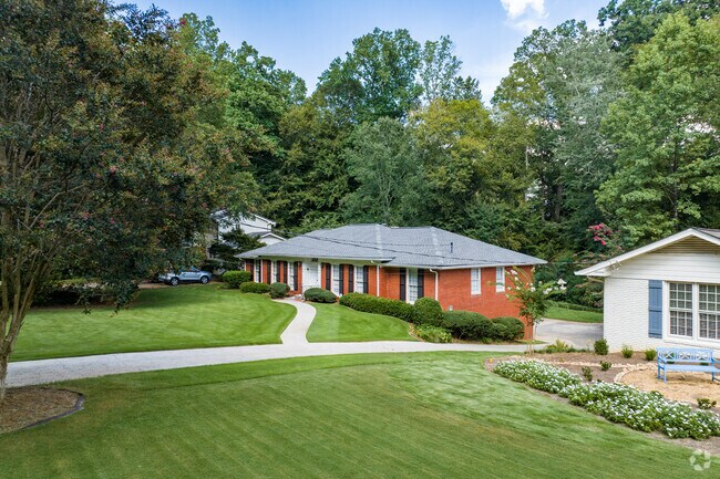 Brick ranch homes can be found in Chastain Park on lots with maintained landscaping.