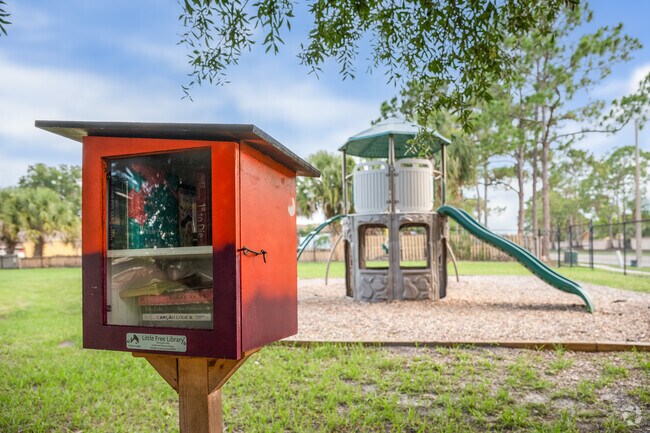 Residents of Peppermill exchange books at The Little Library while their children enjoy the community playground.