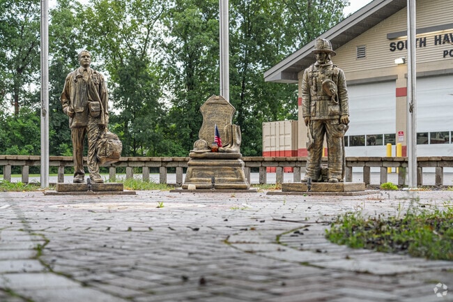 A memorial of bronze statues honors firefighters outside the South Haven Fire Department.