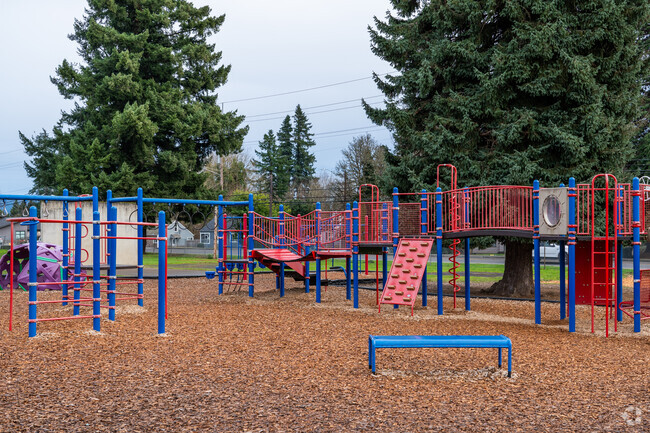 Play structures featuring slides and monkey bars.