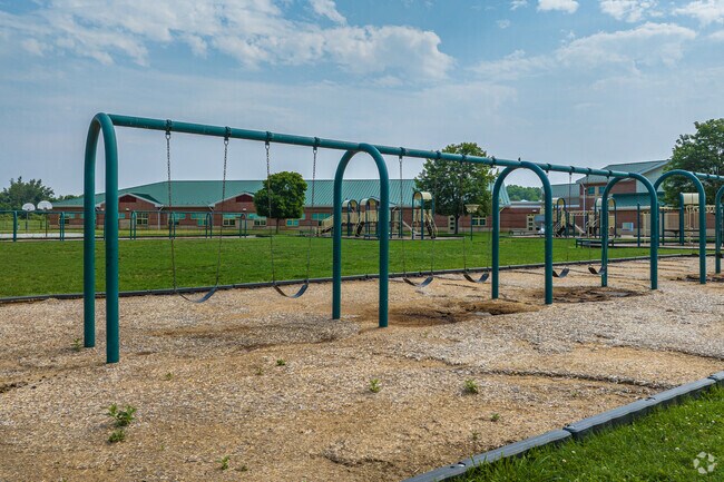 At recess, students can swing on the large swing set at Southern Elementary in New Castle.